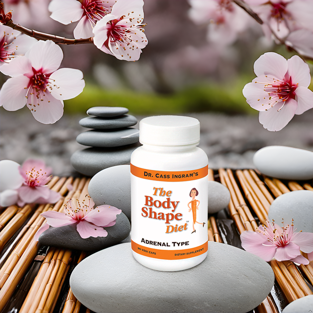 The Body Shape Diet Adrenal Support Formula placed against a backdrop of blooming flowers, emphasizing the purity and natural origins of its ingredients, crafted under Dr. Cass Ingram’s guidance.