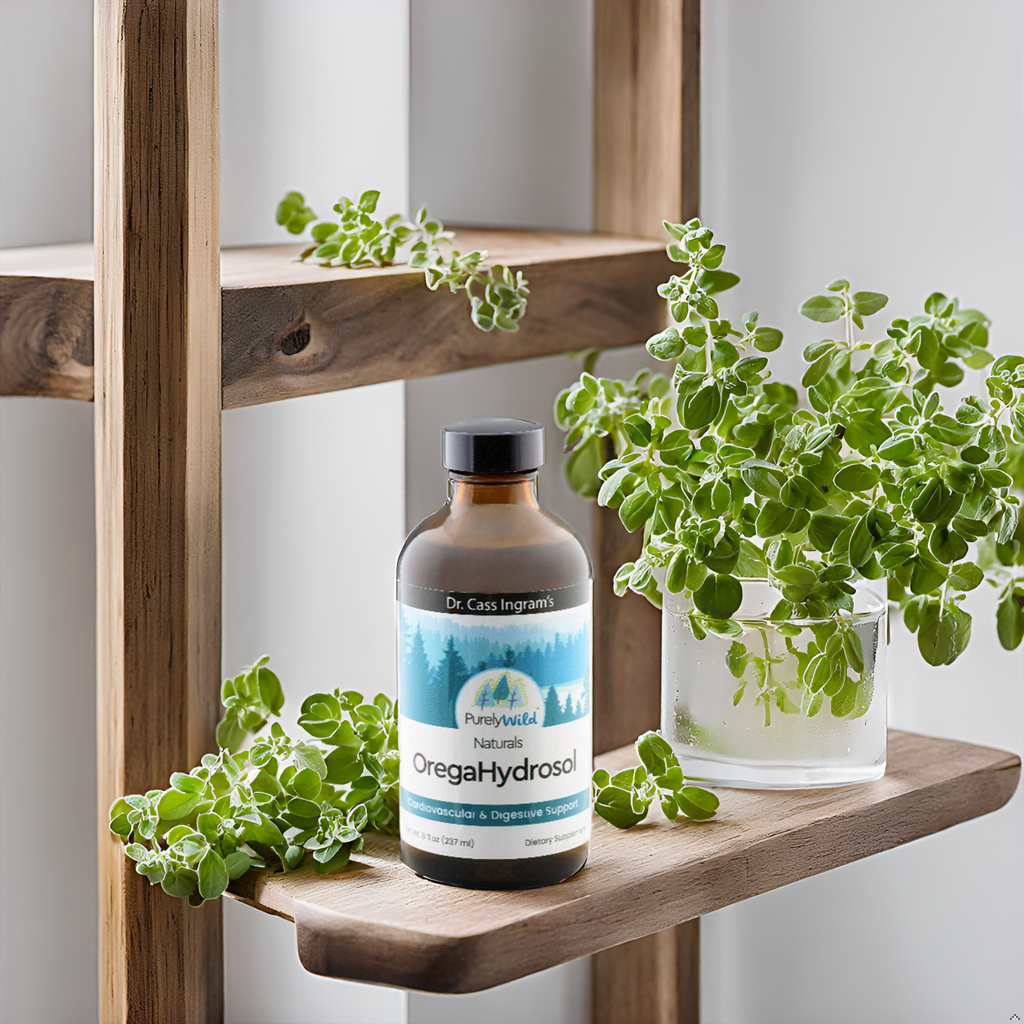 A stylish kitchen counter with a bottle of Dr. Cass Ingram's OregaHydrosol surrounded by fresh oregano, highlighting the product's natural origins.