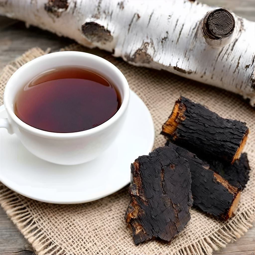  A canister of Purely Wild Chaga Birch Bark Tea next to a cup of brewed tea, showcasing the aromatic and potent infusion crafted using Dr. Cass Ingram’s expertise.