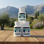Three bottles of PureVita Oregano Oil Capsules on a wooden table with a mountainous background.