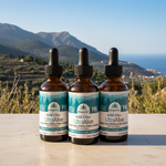 Three bottles of UltraAlive supplement with a scenic background of mountains and ocean.