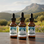 Three bottles of PurelyVital Oregano Oil with a scenic background of mountains and fields.